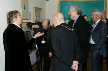 Sally Moss describes the Graham Sutherland Portal to Mike Toobey, Simon Hancock ( Chair Pembrokeshire Coast National Park Authority) and the First Minister.